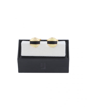 Gold-finish cuff links with black enamel.